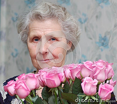 granny-behind-bouquet-of-pink-rose-thumb4718138.jpg